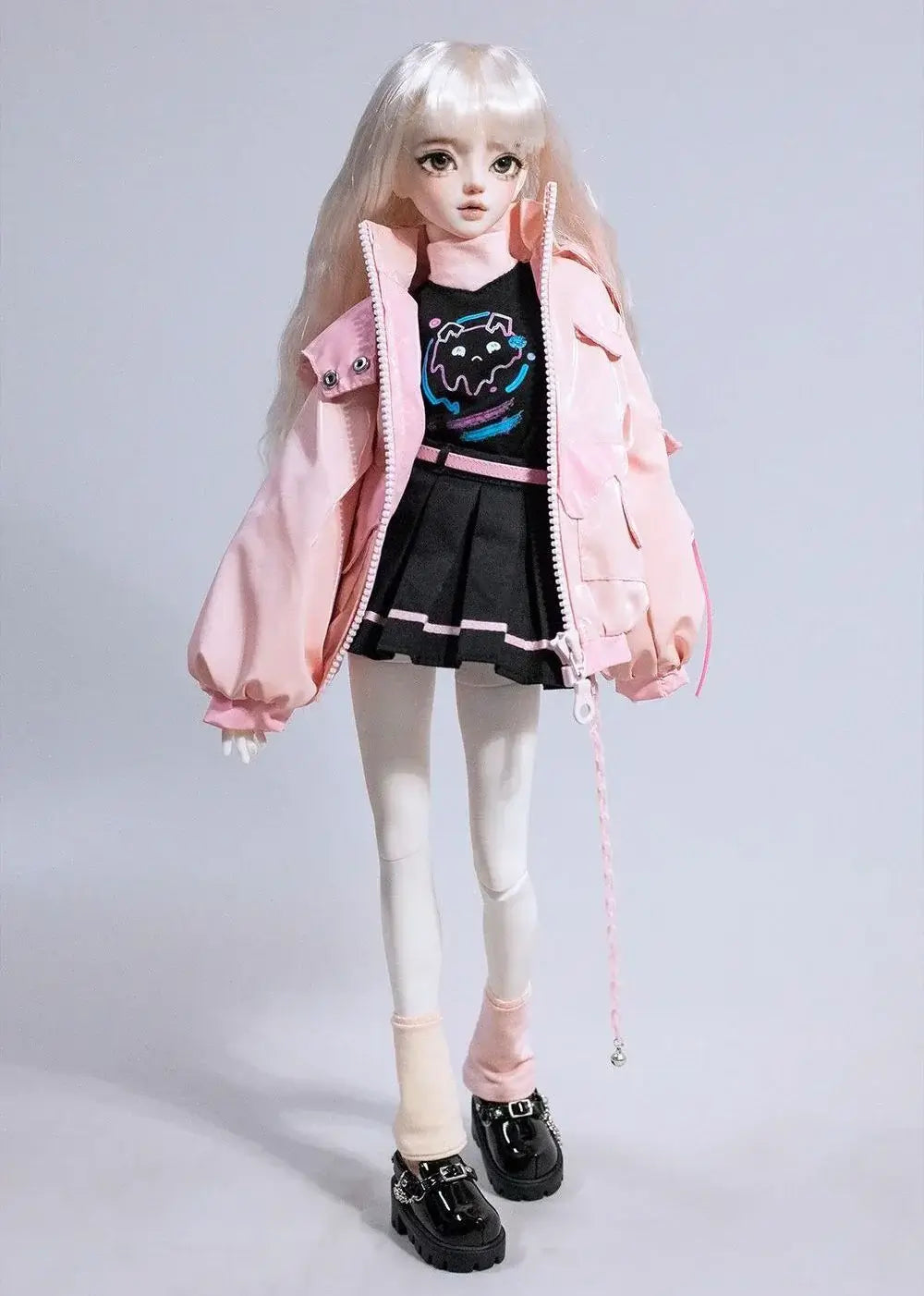 BJD doll wearing a pink jacket and black skirt, showcasing trendy outfit and accessories for 1/4 size girls.