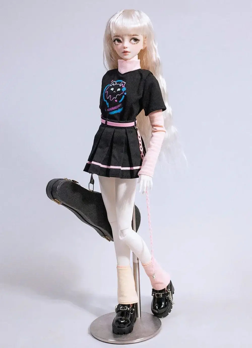 BJD 1/4 size girl outfit featuring a black dress, T-shirt, skirt, and accessories, styled on a doll with long hair.