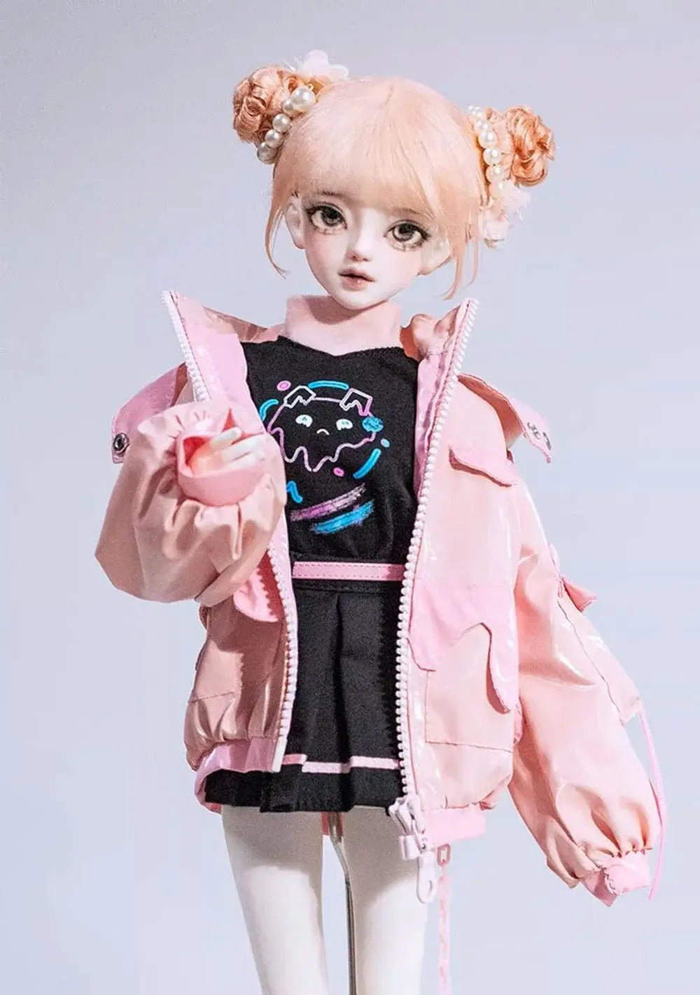 1/4 BJD girl doll wearing a pink jacket and cute outfit with hairstyle featuring two buns.